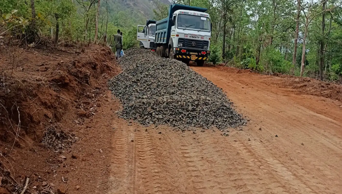 Aggregate laying during road construction at Karjat